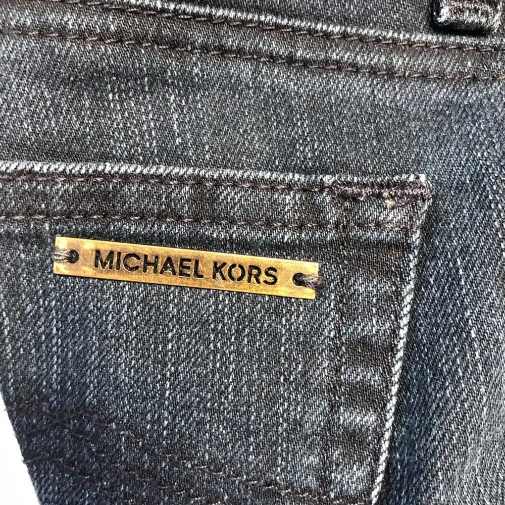 Michael Kors Blue jeans with raw edge folded hem tapered stretch. Size 4.